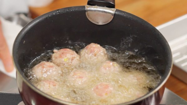 Don’t touch the meatballs until the surface firms up. Occasionally shake the pot to keep the bottom of the meatballs from burning.