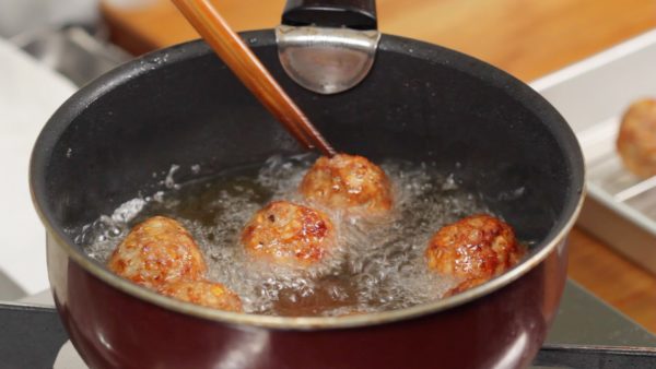 When the surface firms up, turn the meatballs over. Keep turning them to brown evenly for 5 to 6 minutes. They will turn to a delicious golden brown color.