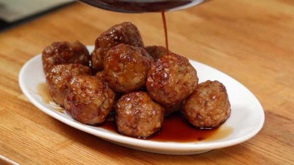 Place the meatballs onto a plate along with the sweet and sour sauce.