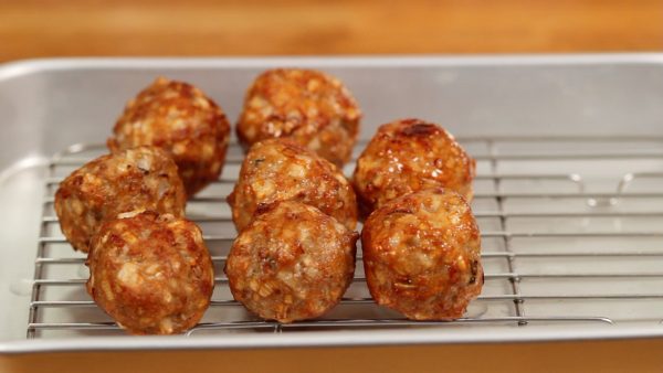 Remove the meatballs and place them onto a cooling rack.