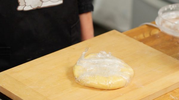 Adjust the edges, shaping the dough into a disk. Wrap the dough with the plastic wrap and let it sit in the fridge for 1 to 2 hours or overnight.