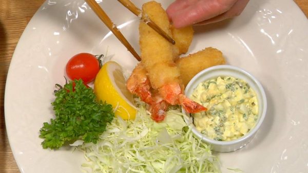 Serve the ebi fry on the plate along with the side vegetables and tartar sauce.