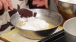 Add one third of the meringue to the batter.