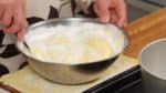 And quickly fold in the batter again but avoid breaking the foam to create a light and fluffy cake.