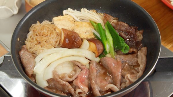 Turn the heat to medium and occasionally flip the ingredients over to cook evenly. It’s ready to serve. As soon as each ingredient is cooked dip them in the egg and enjoy the sukiyaki.