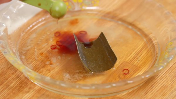 Add the vinegar, yuzu citrus juice, dashi kombu seaweed, dried red chili pepper and soy sauce. You can use any type of sour citrus juice instead of the yuzu juice. Stir to mix.
