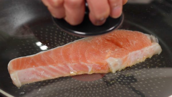 Add oil again and reheat the pan. Place the salmon into the pan. Saute the top side first so that you can present a beautifully browned surface. Occasionally shake the pan to brown evenly. Cover and saute on low heat.