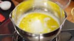 Swirl the pot to even out the temperature. Heat the mixture until just before it begins to boil.