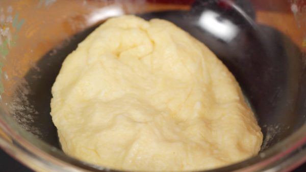 Continue kneading the dough until the cheese is mixed evenly.