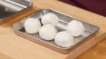 Make sure that the dough has an even thickness and shape it into a ball. Repeat the process for the rest of the anko balls.