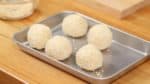 Gently press the dango and the sesame seeds together. If the dough is relatively soft, wetting might not be necessary. Repeat the process and you’ll have 5 goma dango.  