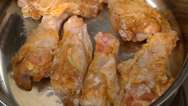 Line up the chicken in the heated pot. Lightly brown the surface and flip them over. The curry powder easily burns so keep your eyes on it.