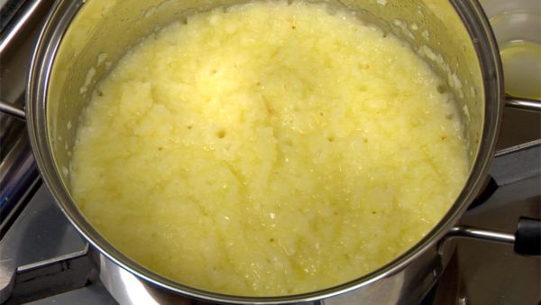 Add a little more olive oil to the pot and drop in the grated onion. Stir the onion on high heat and reduce the liquid.