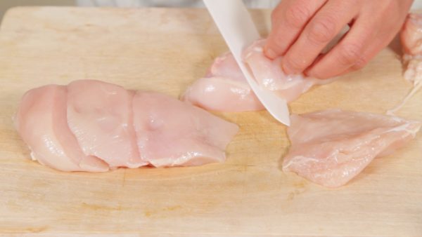 Slice off the thin part of the chicken. Then, slice the rest of the chicken into 5 pieces, cutting at an angle. Make sure that each piece has about the same thickness.