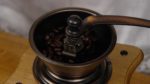 Let's grind the coffee beans to make fresh coffee. Using a hand-cranked coffee grinder is fun and gives you a special hands-on feel!