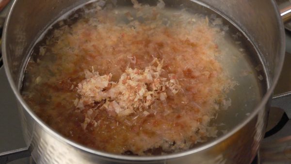 Turn off the burner and add the bonito flakes. Let it sit for 2 to 3 minutes.