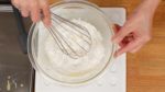 Add the baking powder to the cake flour and stir to combine. Then, sieve the flour into a bowl. Add the flour to the egg mixture. Gradually mix it from the center to the outside. This will help to avoid any pockets of dry flour.