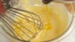 Add the lukewarm melted butter to the mixture a little at a time. Avoid using hot butter otherwise the baking powder will activate.