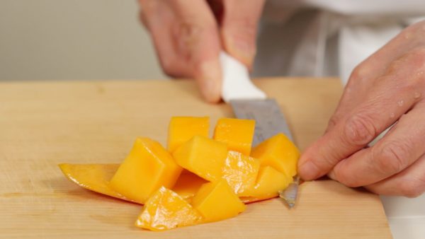 Cut the mango in half lengthwise and peel off the skin. Looks so delicious!