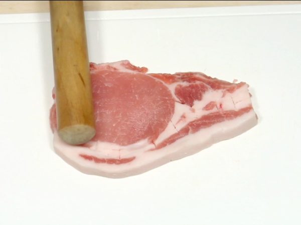 Tenderize the pork slice with a meat pounder. Sprinkle the salt and pepper on one side.