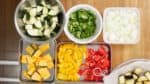 As for the onion, yellow and green bell peppers and zucchini, cut them into 1.5cm (0.6") pieces as well.