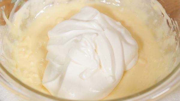 Whip the heavy cream to the almost same consistency as the mascarpone mixture. Add half of the whipped cream to the bowl. With a spatula, combine the mixture.