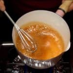 Reduce the heat to low and stir with a whisk. Remove the pot from the burner and swirl it to prevent the sauce from burning.