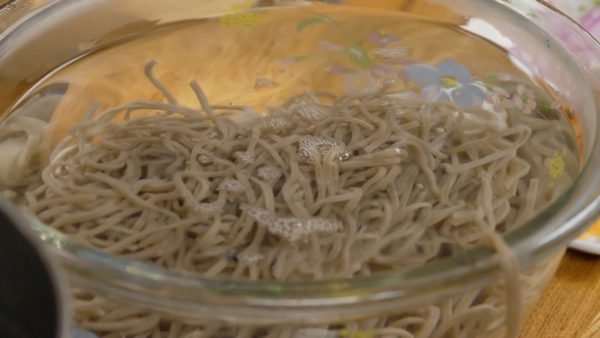 Remove the soba with a mesh strainer and place it into cold water or rinse under running water.