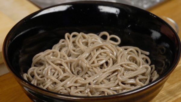 Add the sesame oil and toss to coat. This will help to keep the noodles from sticking together.