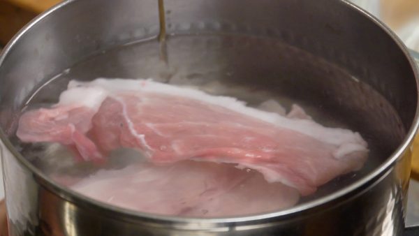 Place the very thin pork loin slices into the same hot water in the pot.