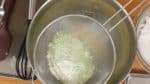 Combine the cake flour, matcha green tea powder, baking powder and a pinch of salt. Stir to mix. Then, sift the flour into the bowl of the egg mixture.
