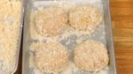 Place the breaded meat onto a tray. Repeat the process for the rest of the meat balls.