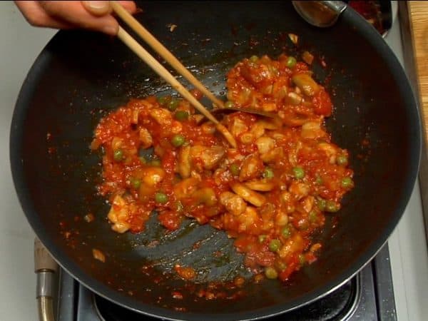 When the sauce begins to sizzle, remove the bay leaf. Test the flavor of the sauce and adjust to taste with salt and pepper. Stir continuously to prevent burning.