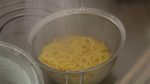 When the noodles are cooked, take the pot to the sink and strain the noodles. Gently rinse the noodles in a mesh strainer under running water and remove the gooey texture on the surface.