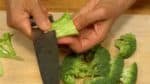 Chop off the broccoli stalk and cut the flower heads into smaller pieces. Peel the stalk and chop into bite-size pieces.