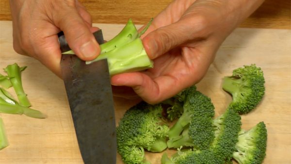 Chop off the broccoli stalk and cut the flower heads into smaller pieces. Peel the stalk and chop into bite-size pieces.