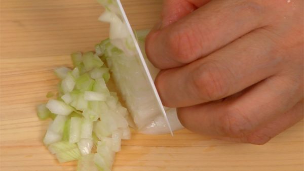 Make vertical cuts in the onion, slice across the initial cuts and chop it into fine pieces.