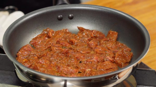 Arrange the beef slices onto a pan. Avoid overlapping the slices. Turn the heat to medium.