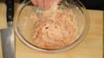 Knead the mixture until the ingredients blend in completely with the chicken.