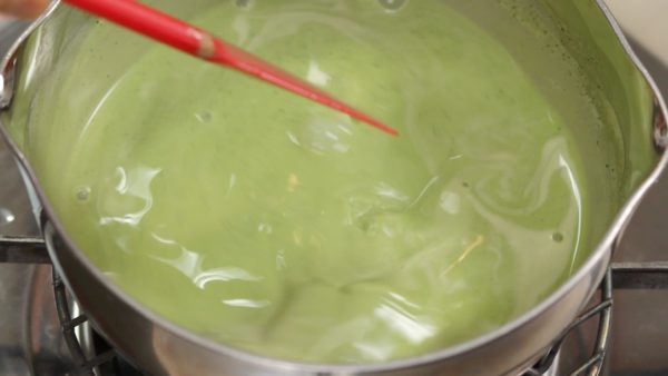 Turn on the burner to slightly thicken the egg mixture. Heat the mixture on low heat and stir continuously. Matcha powder easily settles while baking. Giving the egg mixture a slightly thick consistency will help keep the matcha from settling.