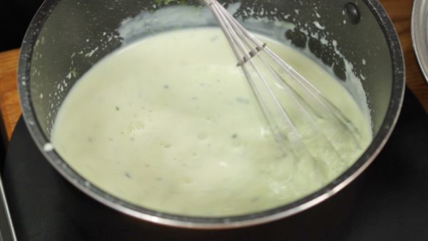 Add the diluted matcha powder. Thoroughly stir the cream mixture. Using a balloon whisk will help to mix it evenly but be sure not to make any foam. It's OK that some lumps of matcha are still remaining at this stage.