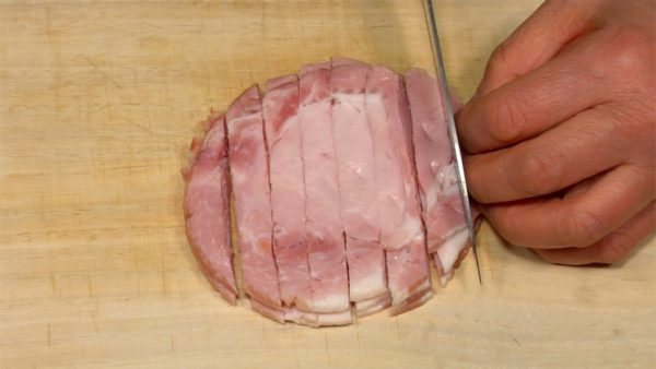 Cut the pork loin ham slices into 8mm (0.3") width strips. Slice the button mushrooms into 5mm (0.2") slices.