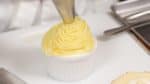 Arrange a generous amount of sweet potato cream onto the whipped cream, shaping it into a mountain.