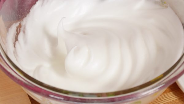 Beat until the meringue reaches a stiff peak stage and has a glossy texture. With the desired consistency, it will not drop out of the bowl when it is turned upside down.