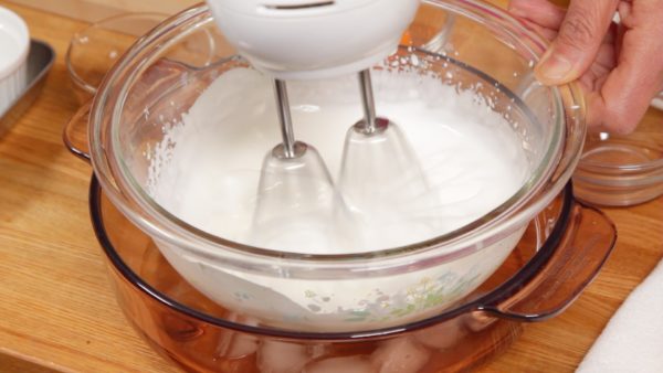 Clean the beaters and then beat the heavy cream in a bowl chilling in ice water. Make sure to beat the egg whites first and do not reverse the order. When it begins to thicken, switch to a low speed to help avoid over-beating.