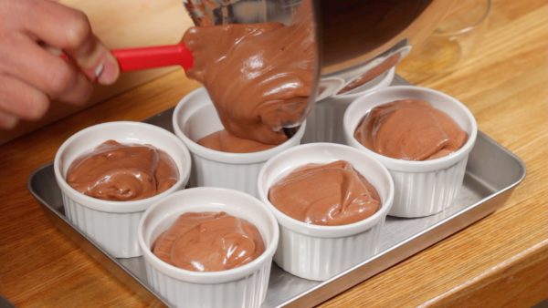 Pour the chocolate mousse into the 6 ramekins.
