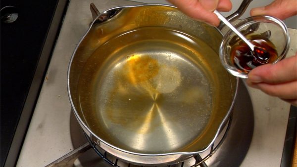 Add the sake, salt and usukuchi soy sauce to the stock. Stir with a set of saibashi chopsticks. Bring it to a boil and turn off the burner.