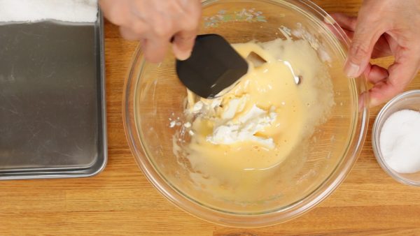 Add one third of the mascarpone cheese. Press it with a spatula and thoroughly combine the mixture.