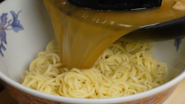 Place the ramen into a bowl. Pour the broth over it and loosen up the noodles.
