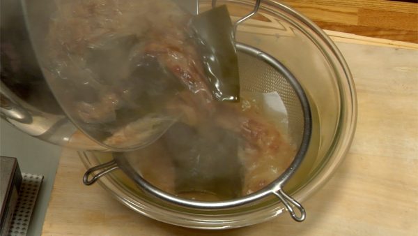 Turn off the burner and strain the stock through the paper towel and wire sieve.